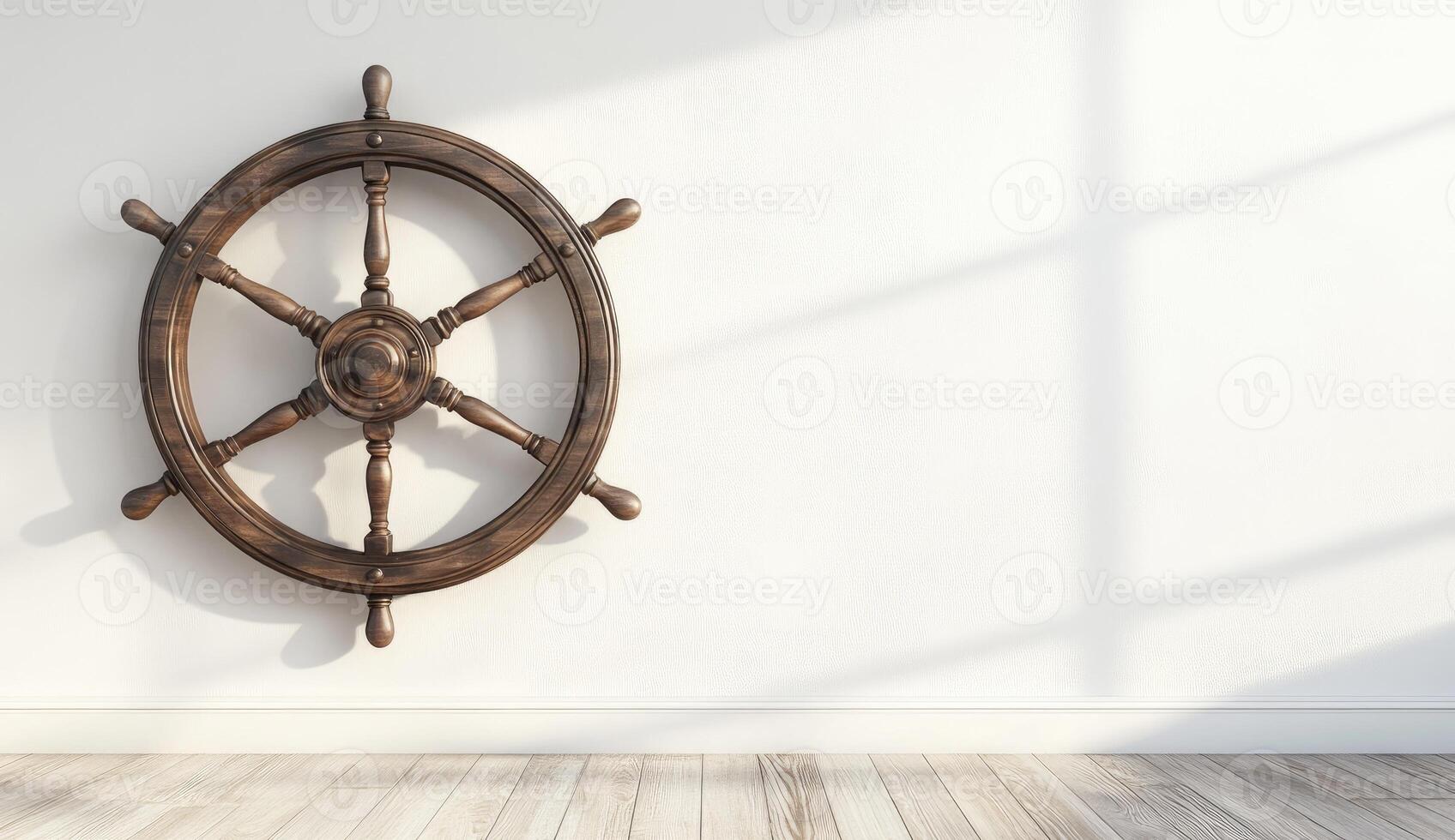 Wooden ship's wheel on white wall. Sunlight casts shadows photo