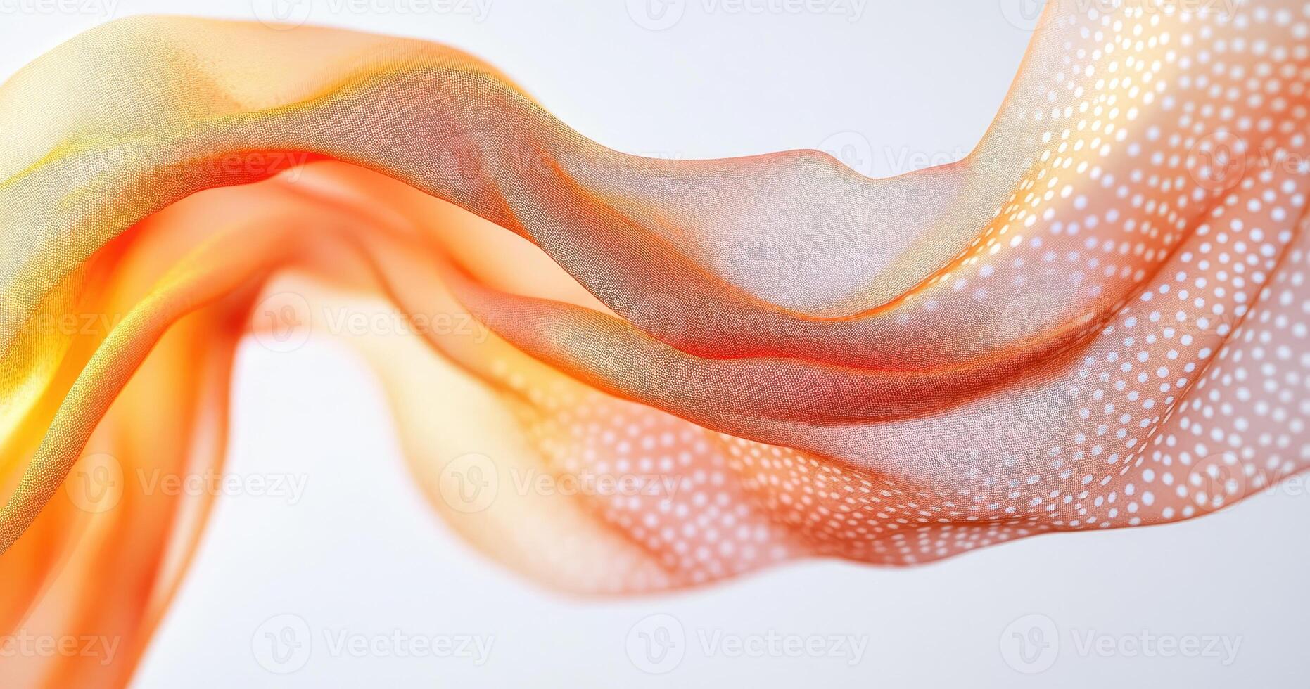 Orange-toned flowing fabric with dotted pattern photo