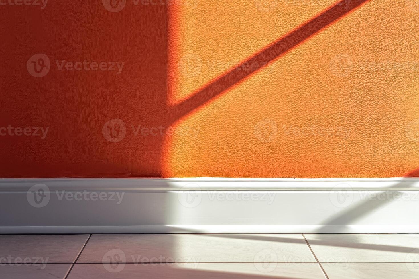 Sunlight casts sharp shadows on an orange wall photo