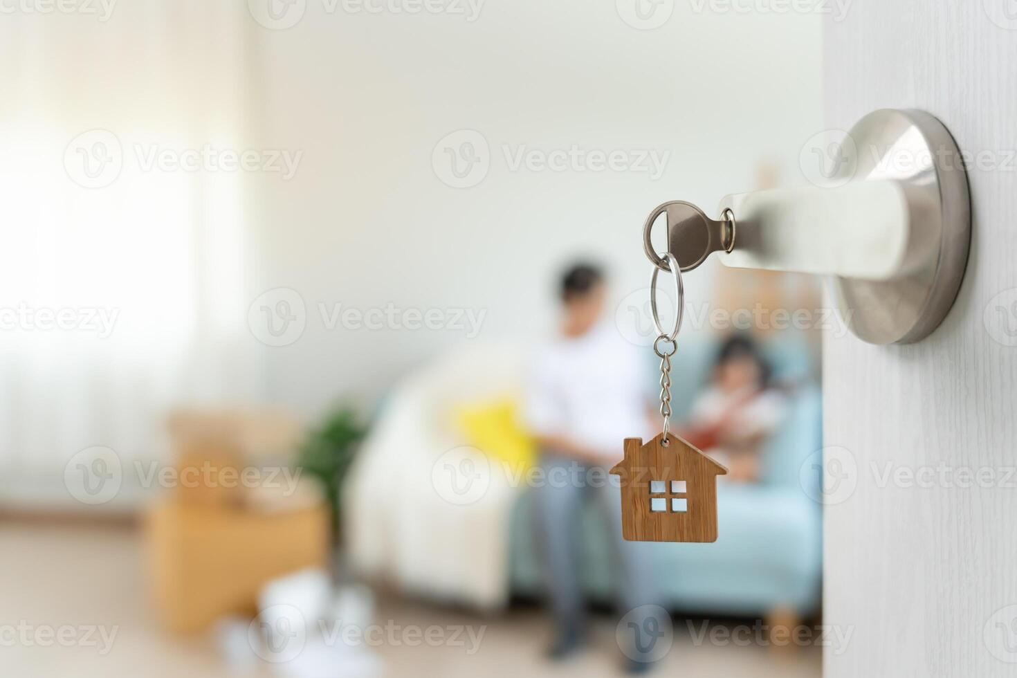 Moving house. relocation. Open the door found daughter play on new house, inside the room was a cardboard box contain personal belongings and furniture. move in the new apartment or home. photo