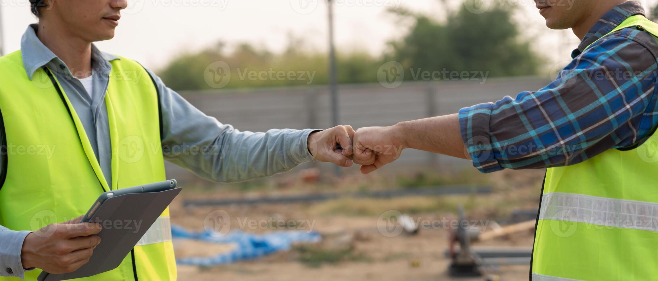 Construction team fist bump greeting start up plan new project contract in office center at construction site, industry ,architecture, partner, teamwork, agreement, property, contacts photo