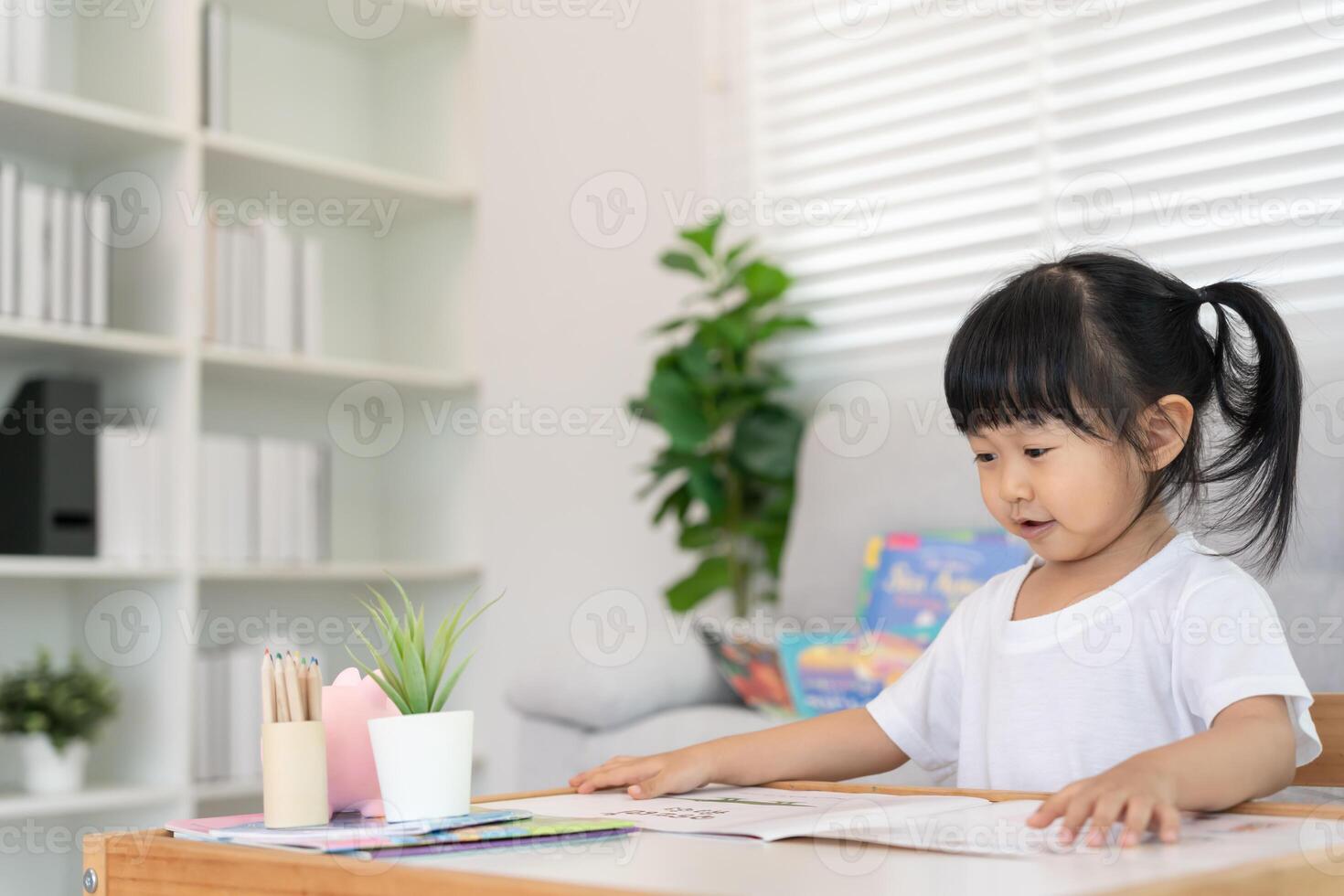 Happy Asian children relax read book for bear doll. daughter and reading a story. learn development, childcare, education, storytelling, practice, imagine, reduce addiction mobile phone photo