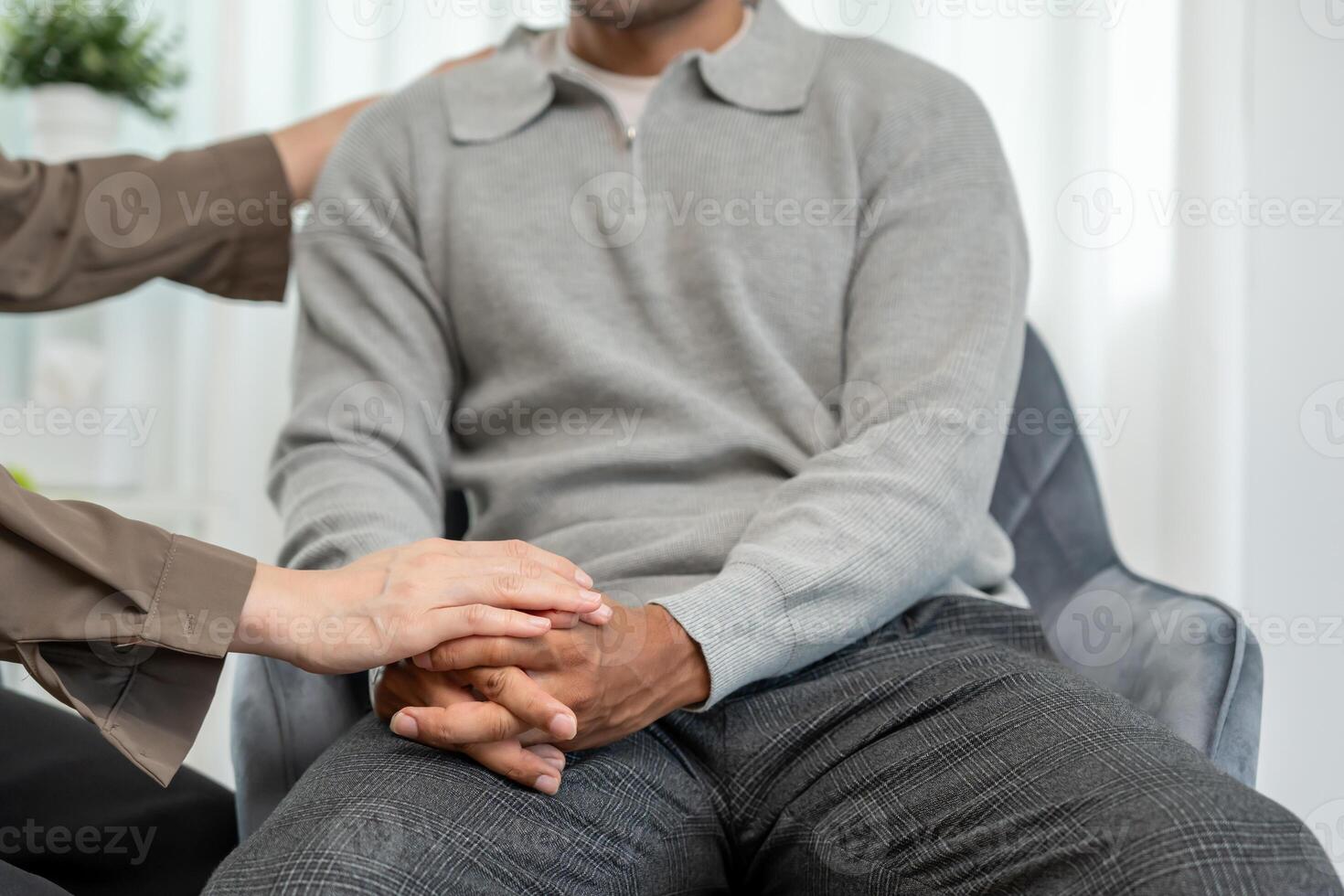 psychiatrist hold hand support each while discussing family issues. doctor encourages and empathy man suffers depression. psychological, save divorce, Hand in hand together, trust photo