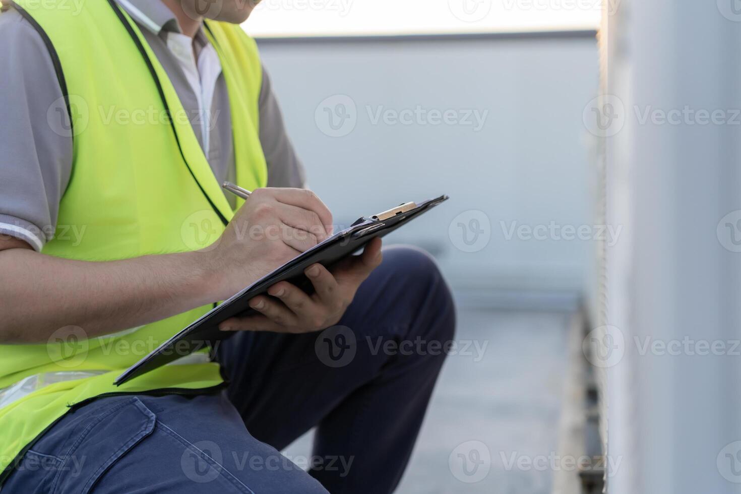 engineer work on the roof of factory. contractor inspect compressor system and plans installation of air condition systems in construction. Checklist, inspector, control. photo