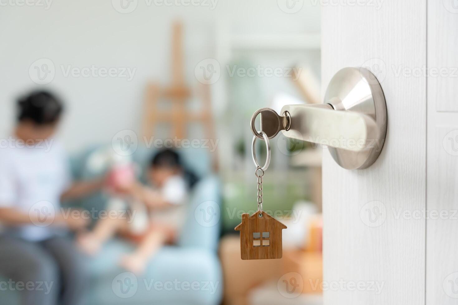Moving house, relocation. Open the door found Family smile and play on new house, inside the room was a cardboard box contain personal belongings and furniture. move in the new apartment or home, photo