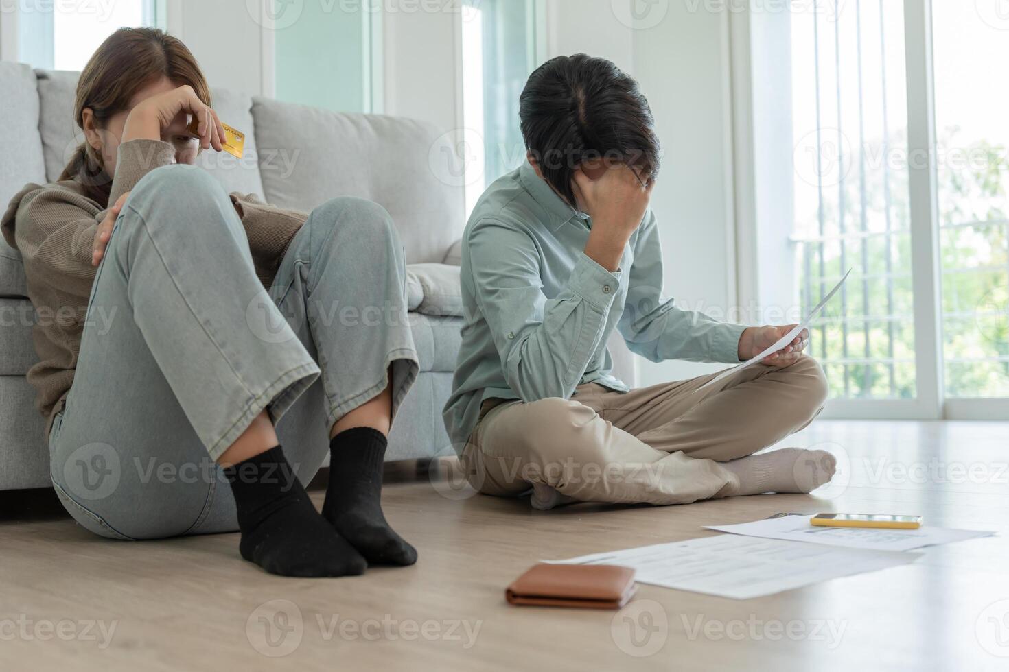 headache couple with large bills or invoices no money to pay to expenses and credit card debt. shortage, Financial problems, mortgage, loan, bankruptcy, bankrupt, poor, empty wallet photo