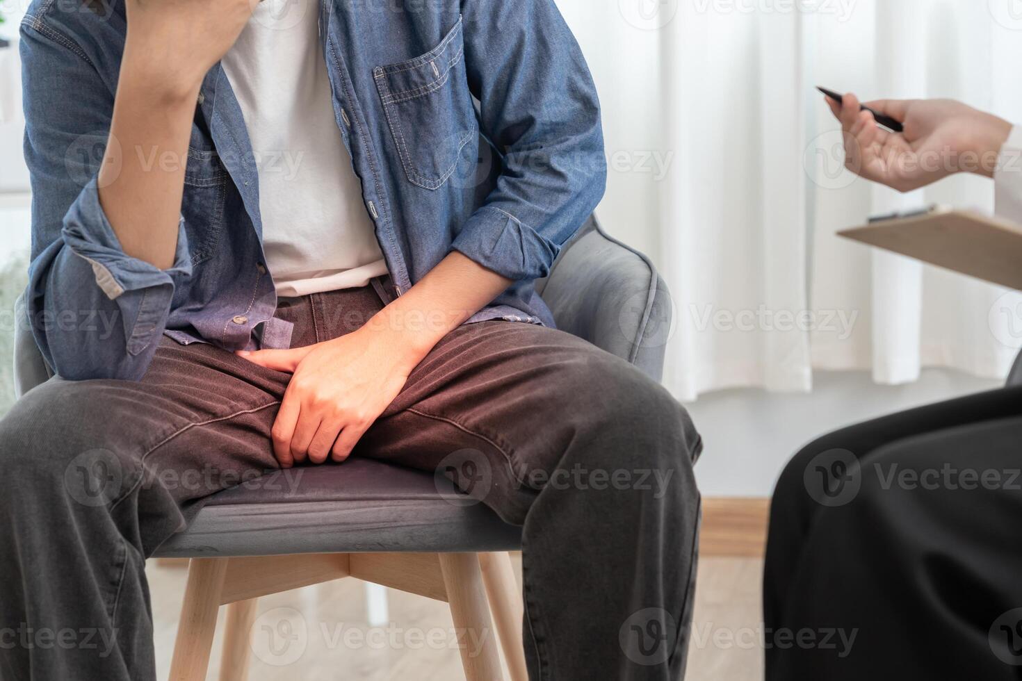 Man hold hand in front of private parts feeling discomfort and consult doctor. Venereal. testicular cancer. bladder problems, erectile dysfunction, premature ejaculation, prostate cancer photo