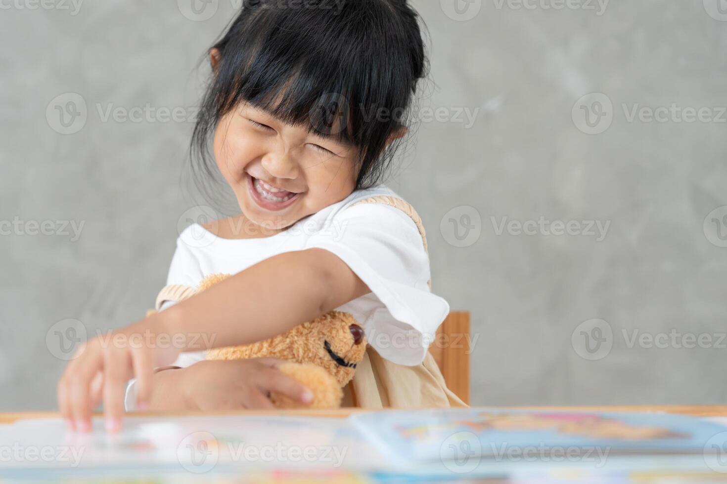 Happy Asian children relax read book at home. daughter and reading a story. learn development. childcare, laughing, education, storytelling, practice, imagine, reduce addiction mobile phone photo