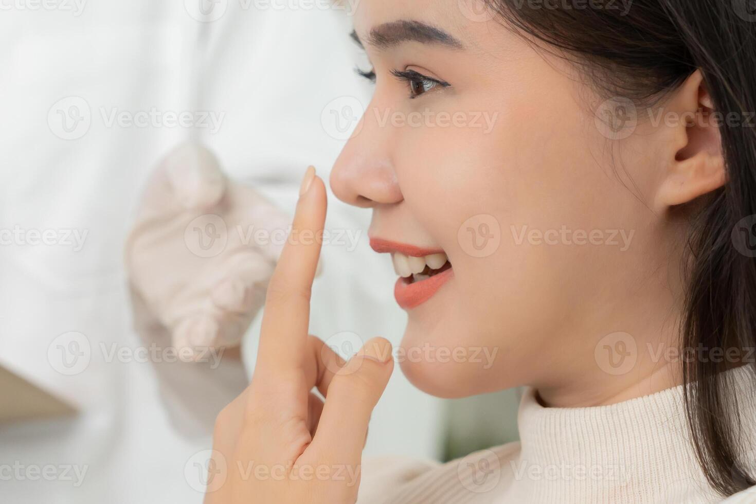 smile and happy after surgery, surgical procedure that involve altering shape of nose, doctor examines patient nose before rhinoplasty, medical assistance, health photo
