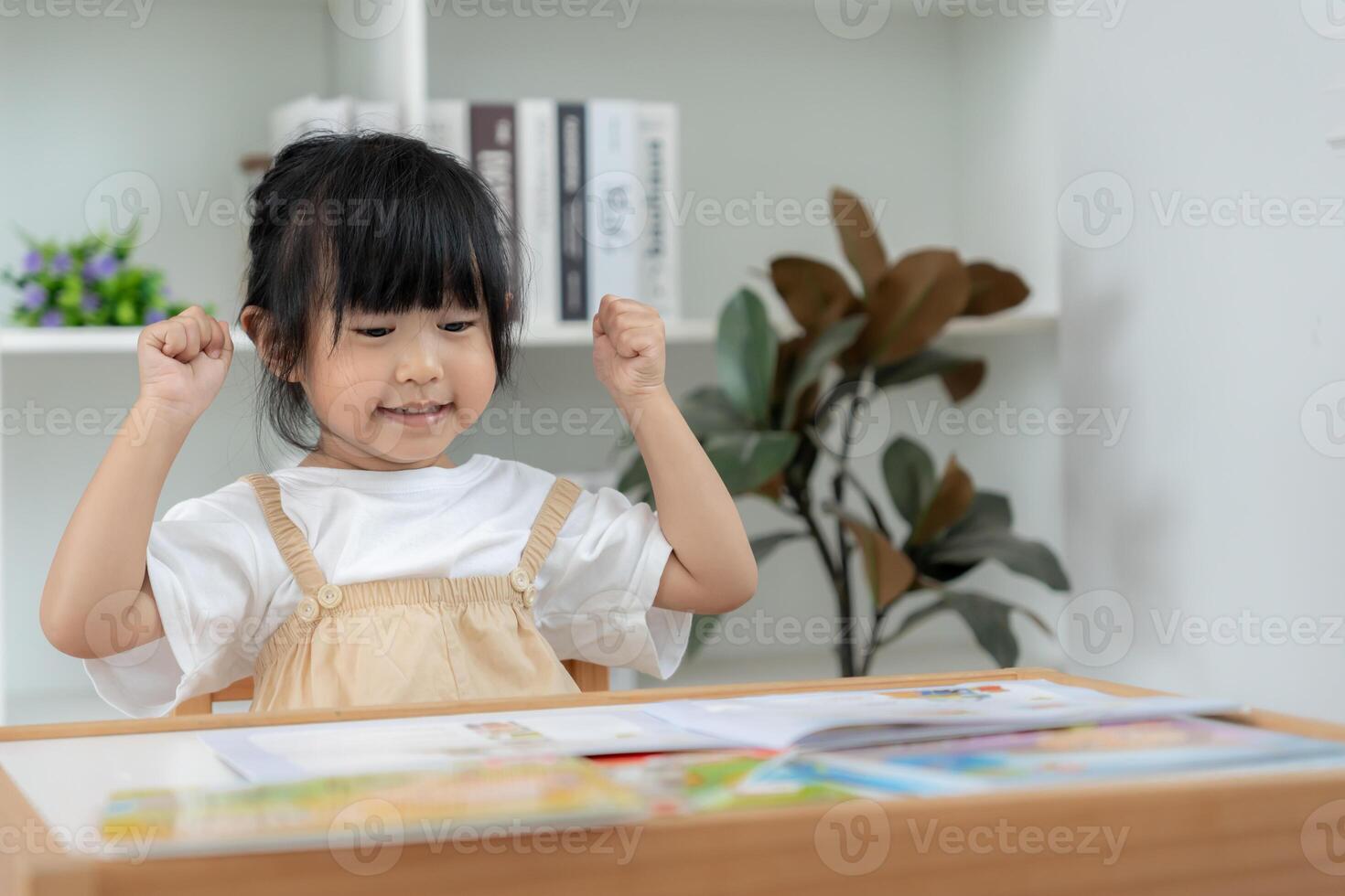 Happy Asian children relax read story book for bear doll. daughter and reading a story. learn development, childcare, education, storytelling, practice, imagine, reduce addiction mobile phone, photo