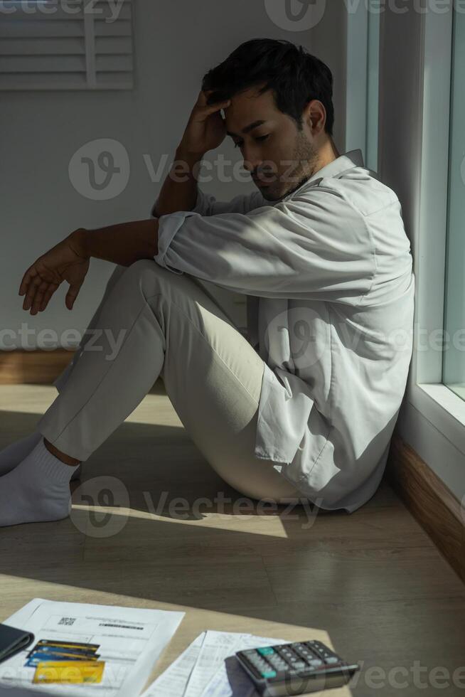 Stressed and headache men with large bills or invoices no money to pay to expenses and credit card debt. shortage, Financial problems, mortgage, loan, bankruptcy, bankrupt, poor, empty wallet photo