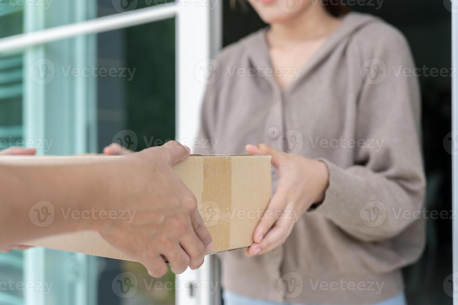 receives boxes parcel from courier in front house. Delivery man send deliver express. online shopping, paper containers, takeaway, postman, delivery service, packages photo