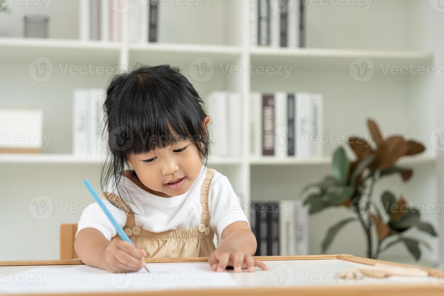 Happy Asia child learn drawing picture and cartoon. Funny family is happy and excited in the house. Mother and daughter having fun spending time together. Holiday, Activity photo
