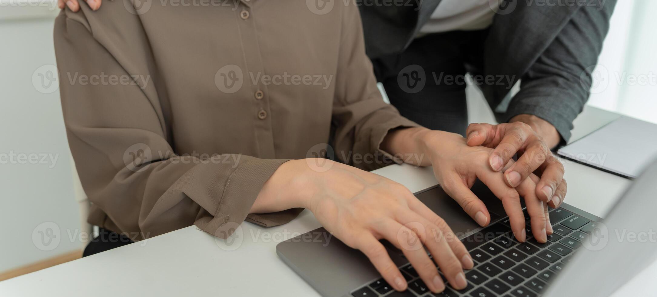 Manager sexually harassed touch hand secretary. Sexual harassment in office. feel anxious and stressed from being harassed. molest, assault, inappropriate, discrimination photo