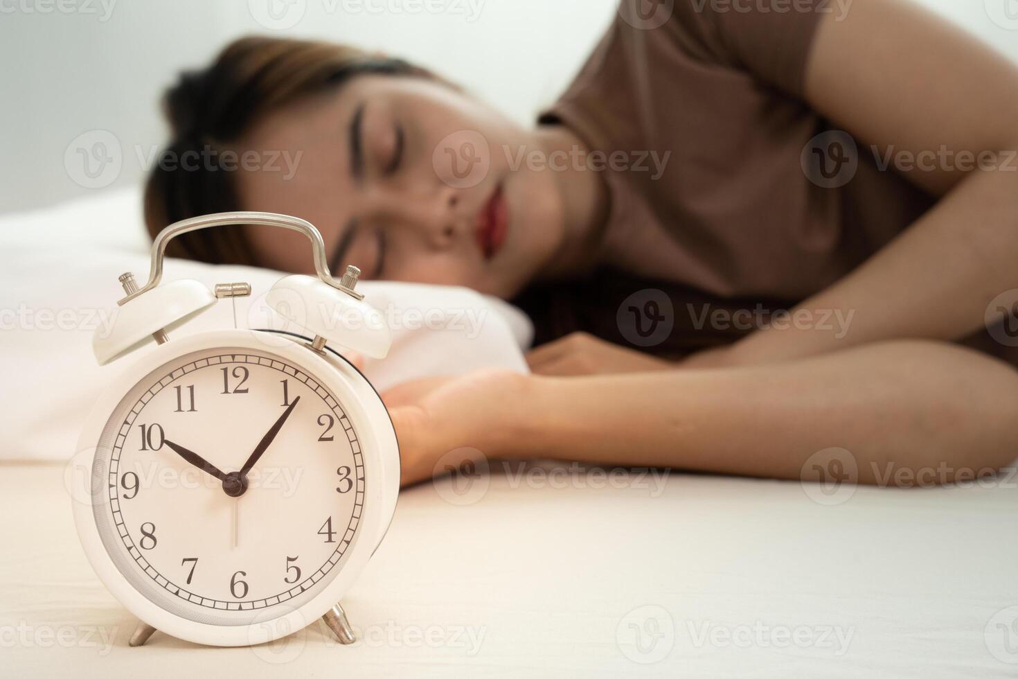 Asia young woman sleep late, lady is late appointment or work or class study, overslept, difficulty get up in mornings, time worried, not on time, over due, over due photo