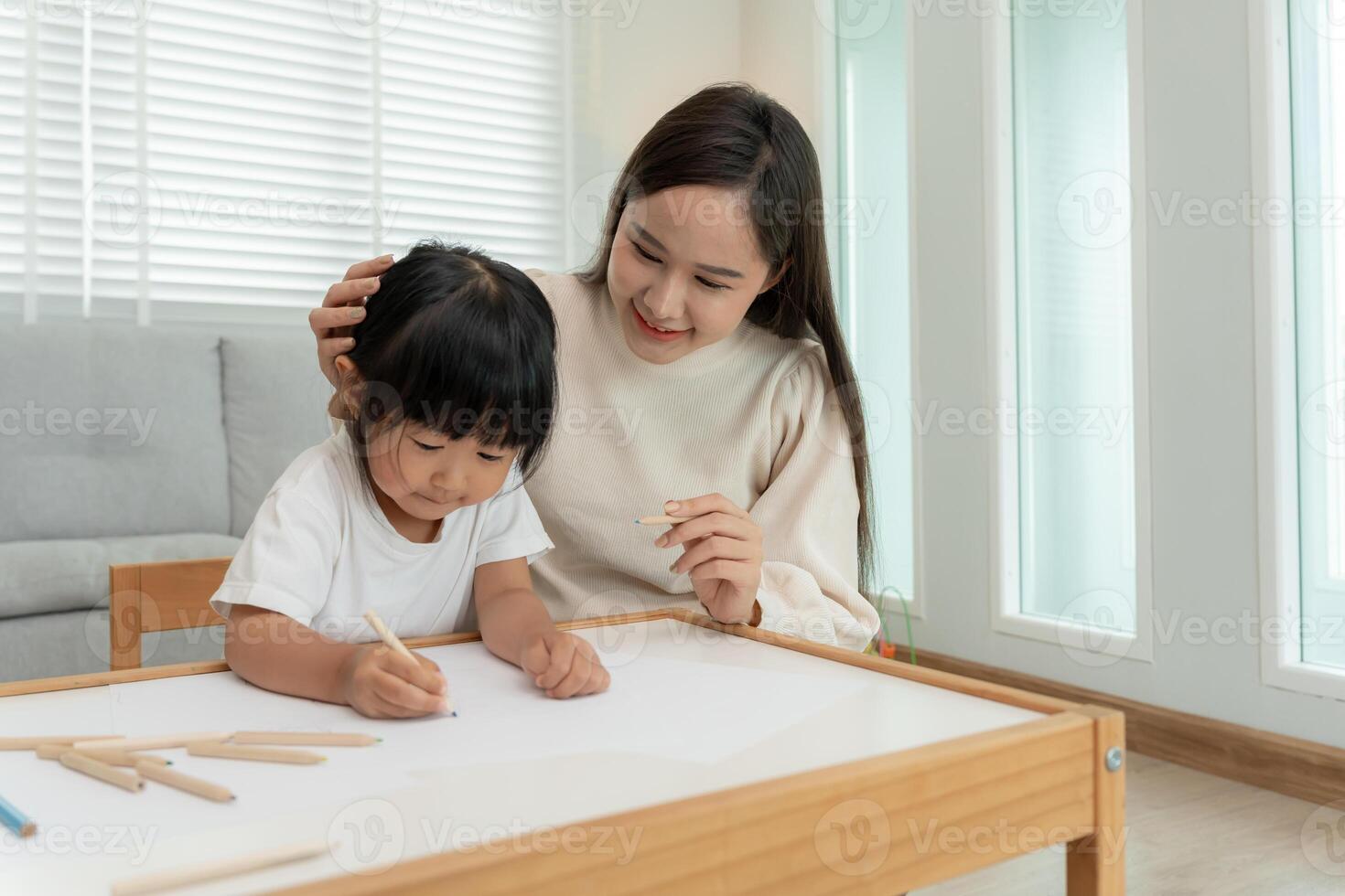Mother day, Happy Asia mother play and learn drawing for little girl. Funny family is happy and excited in the house. Mother and daughter having fun spending time together. Holiday, Activity, photo