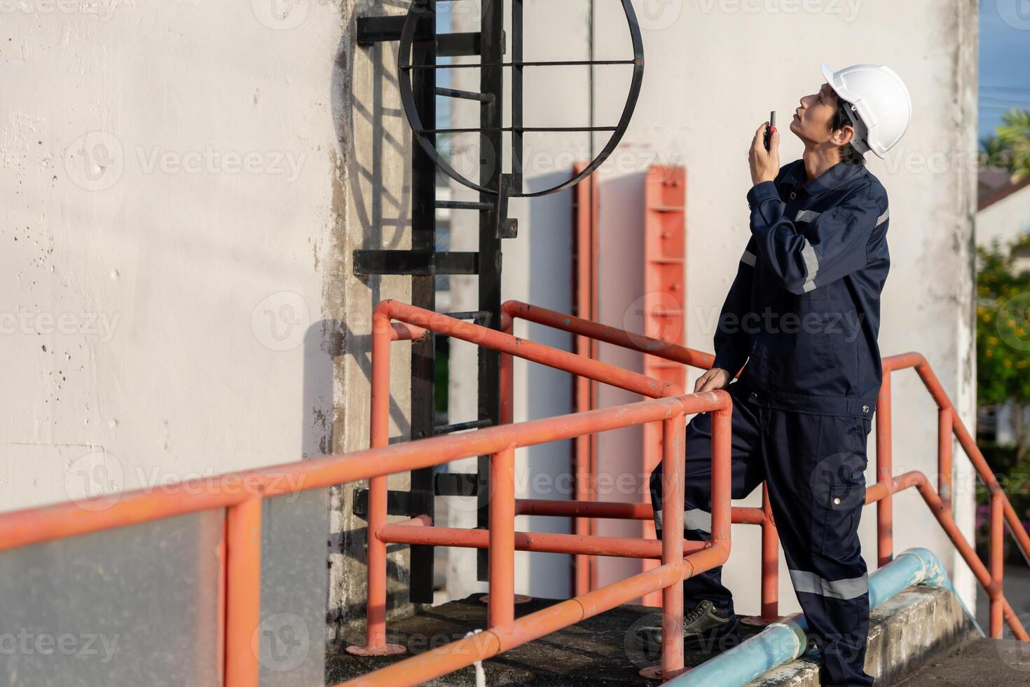 maintenance and inspector. Maintenance engineers are using walky talky to inform the results of inspection of buildings and structures. Irrigation engineers photo
