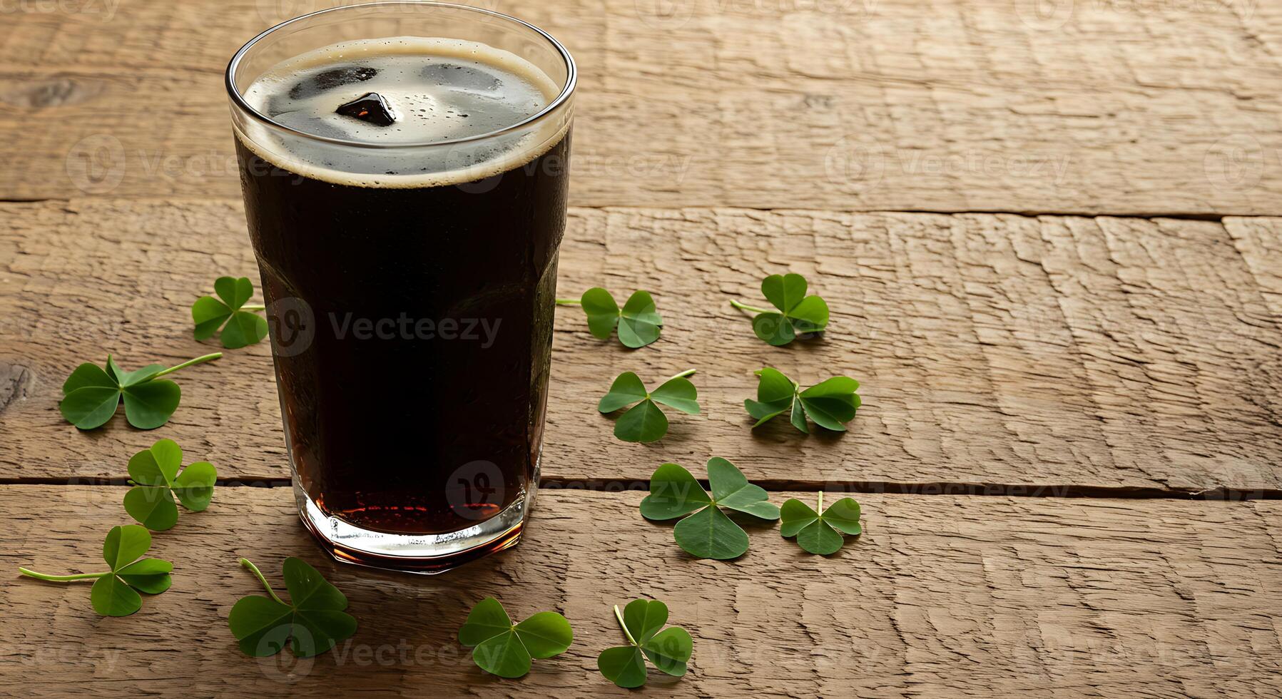 Dark Beverage in Glass with Clover on Wooden Surface for Refreshment Concept photo