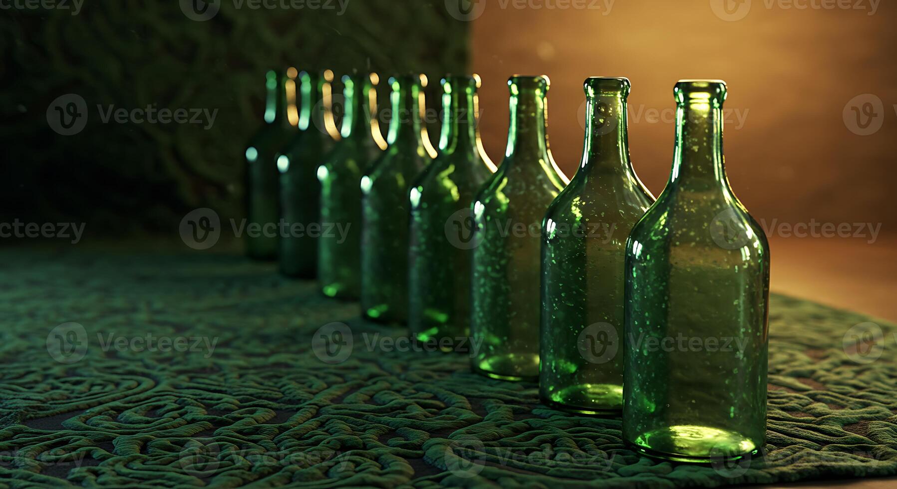 Green Glass Bottles in a Row on a Patterned Surface with Warm Lighting photo