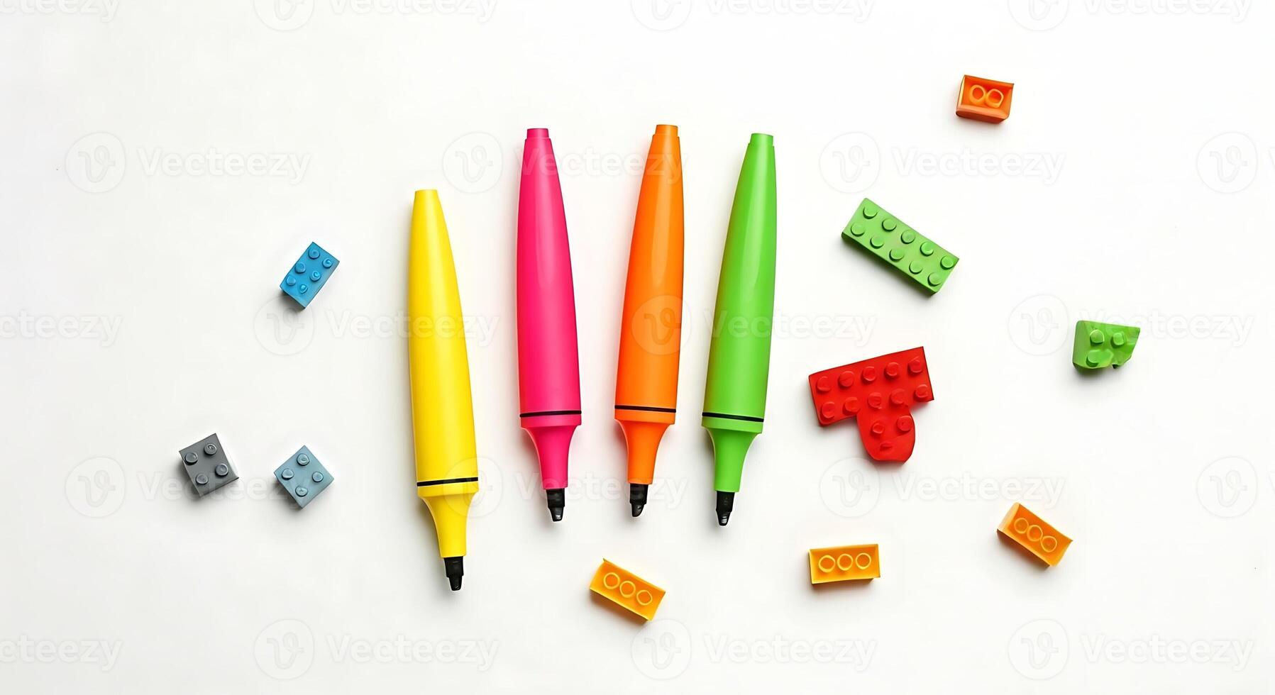 A group of colorful pens and a piece of paper photo
