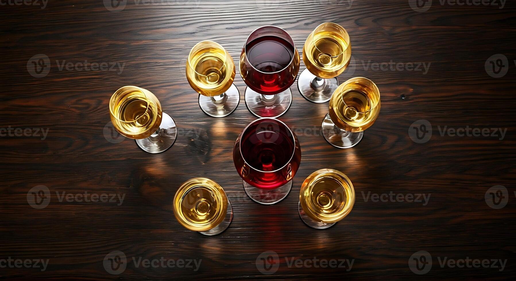 Wine glasses on a wooden table photo