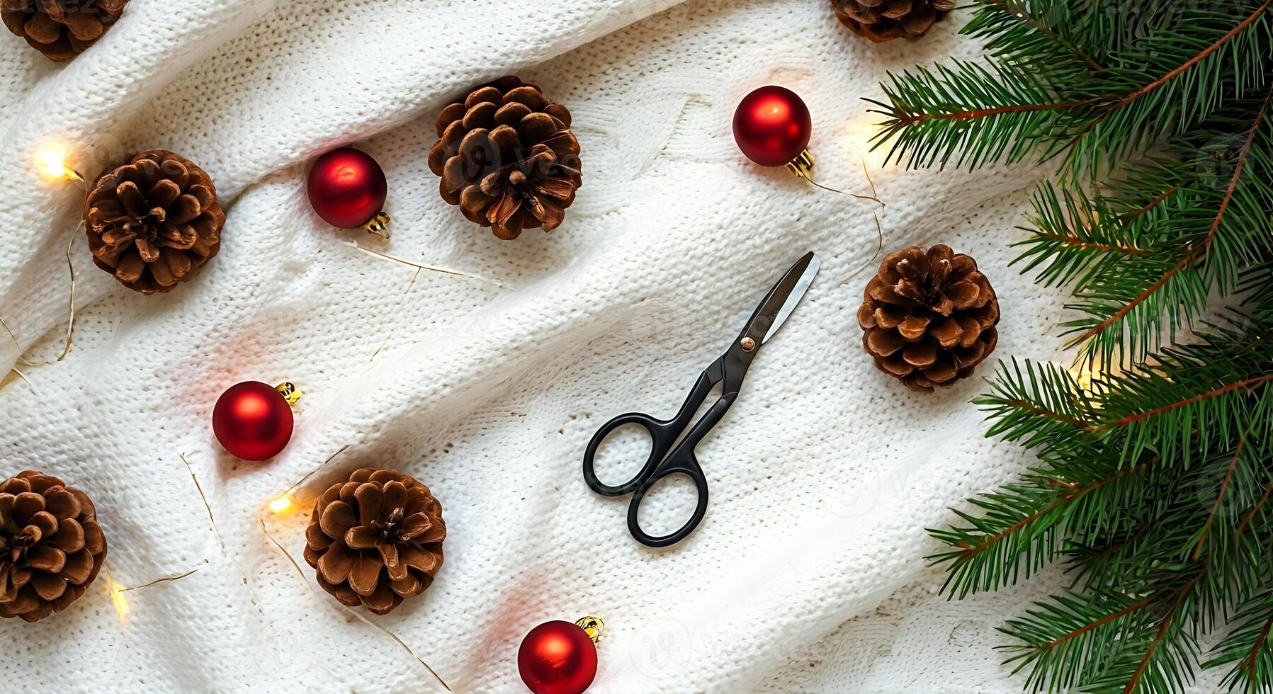 A pair of scissors, pine cones and christmas decorations on a white background photo