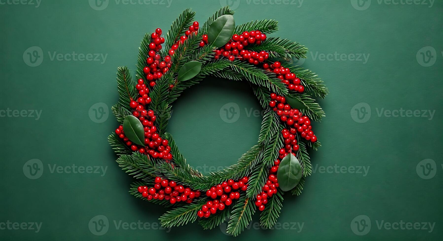 Christmas wreath with red berries on green background photo