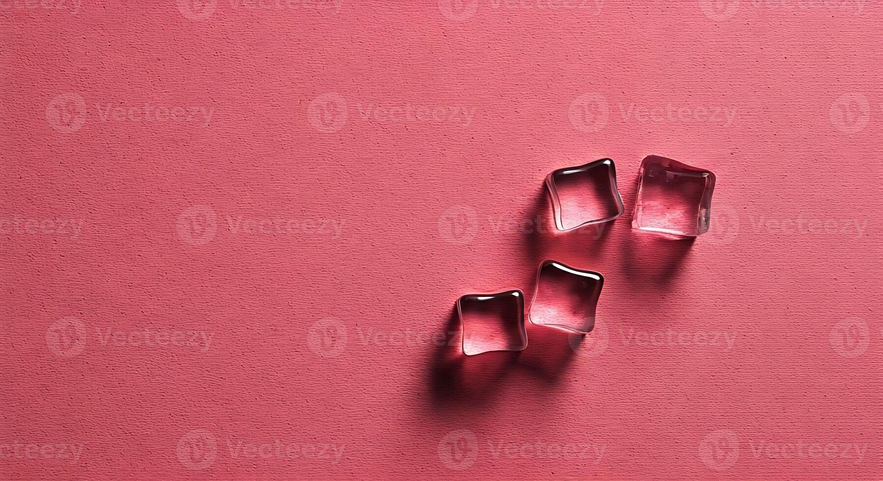 Glass Ice Cubes on Pink Background with Shadow Effect photo