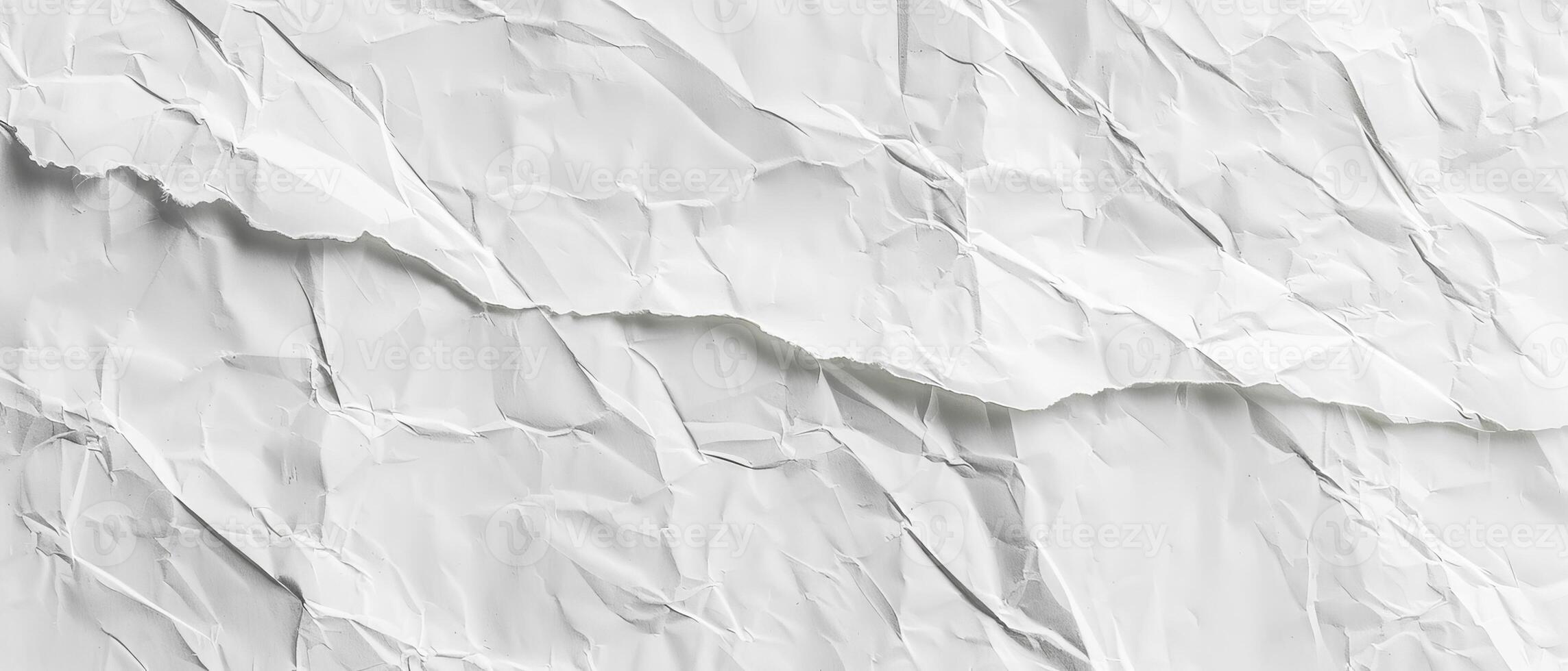 A textured surface of crumpled white paper provides a unique canvas for artistic expressions, ideal for design and creative projects photo