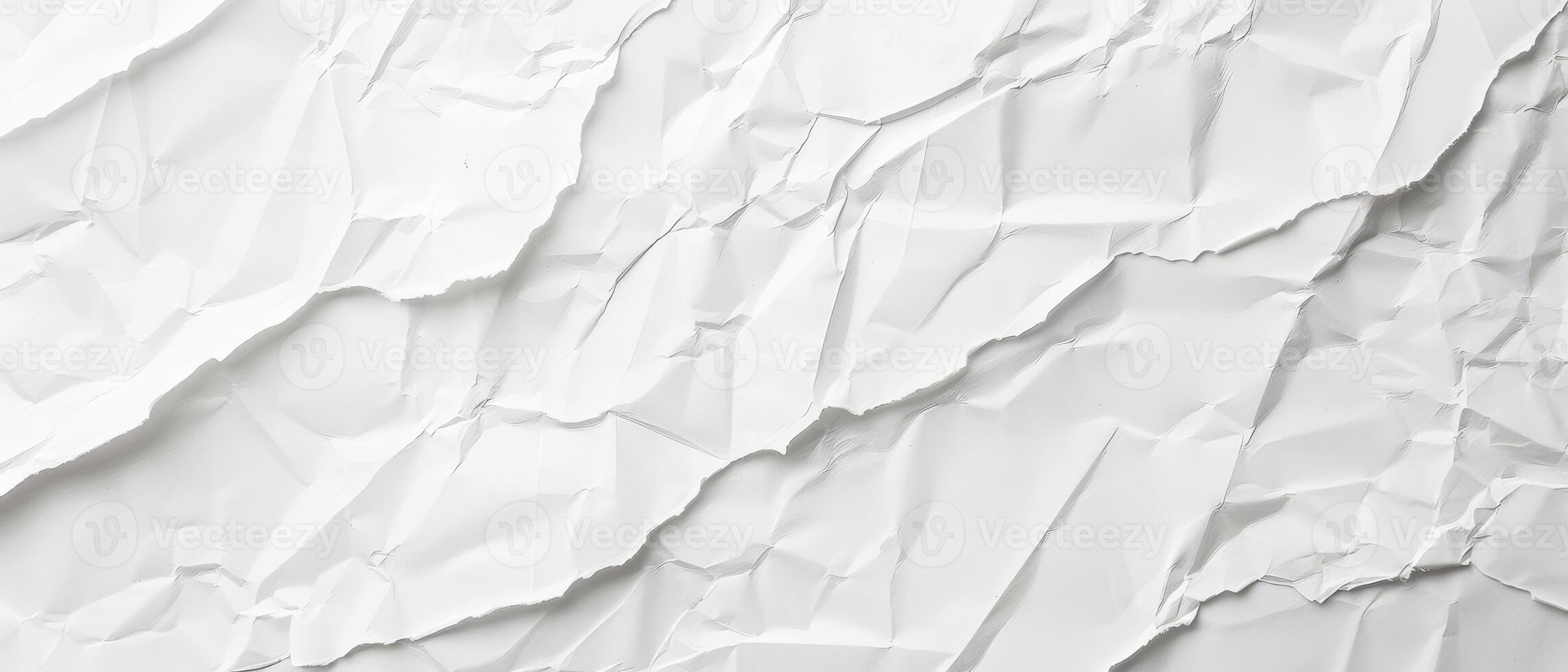 A beautifully crumpled white paper surface provides a clean and artistic backdrop, ideal for projects requiring simplicity and elegance photo