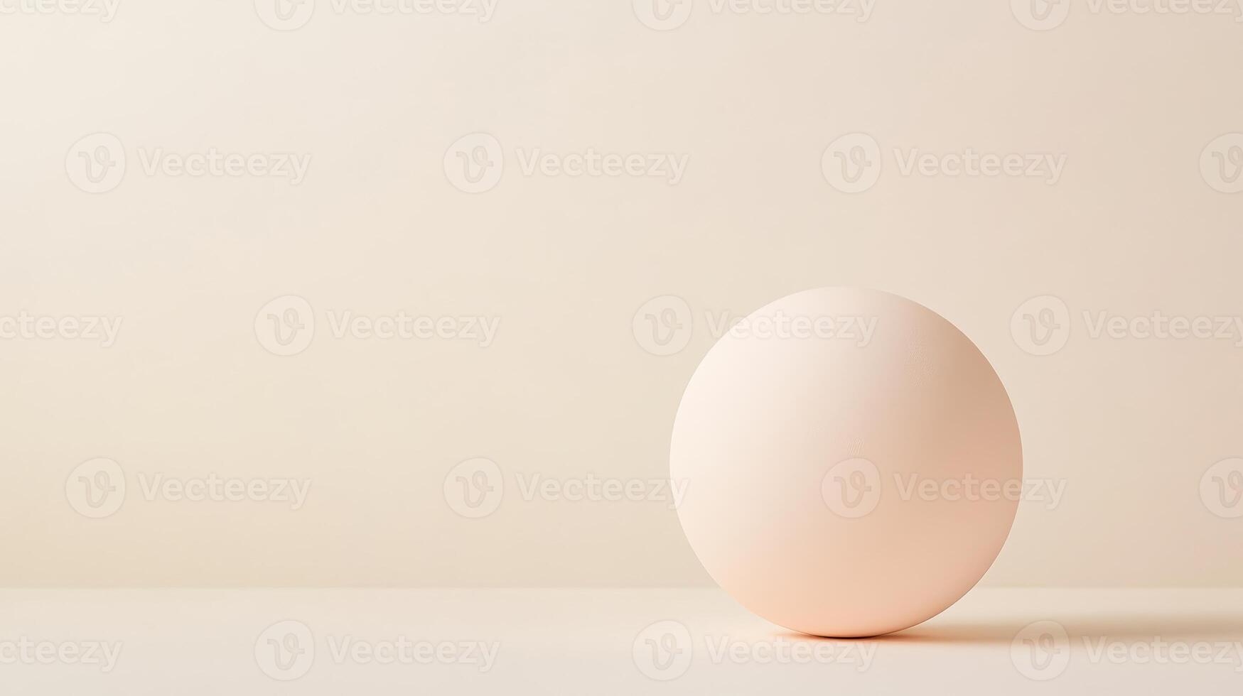 A smooth sphere featuring a delicate gradient rests on a softly lit surface, emphasizing minimalist design and tranquility in space photo