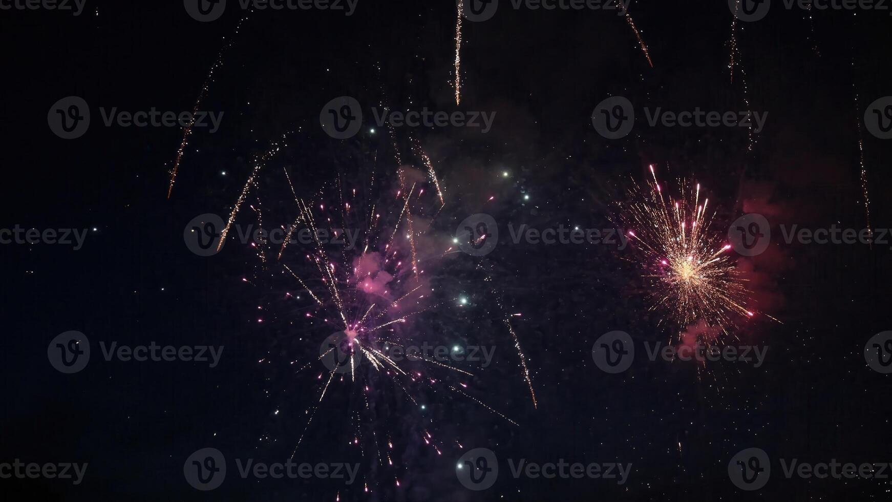 Beautifuil Fireworks exploding in the night sky during a celebration photo