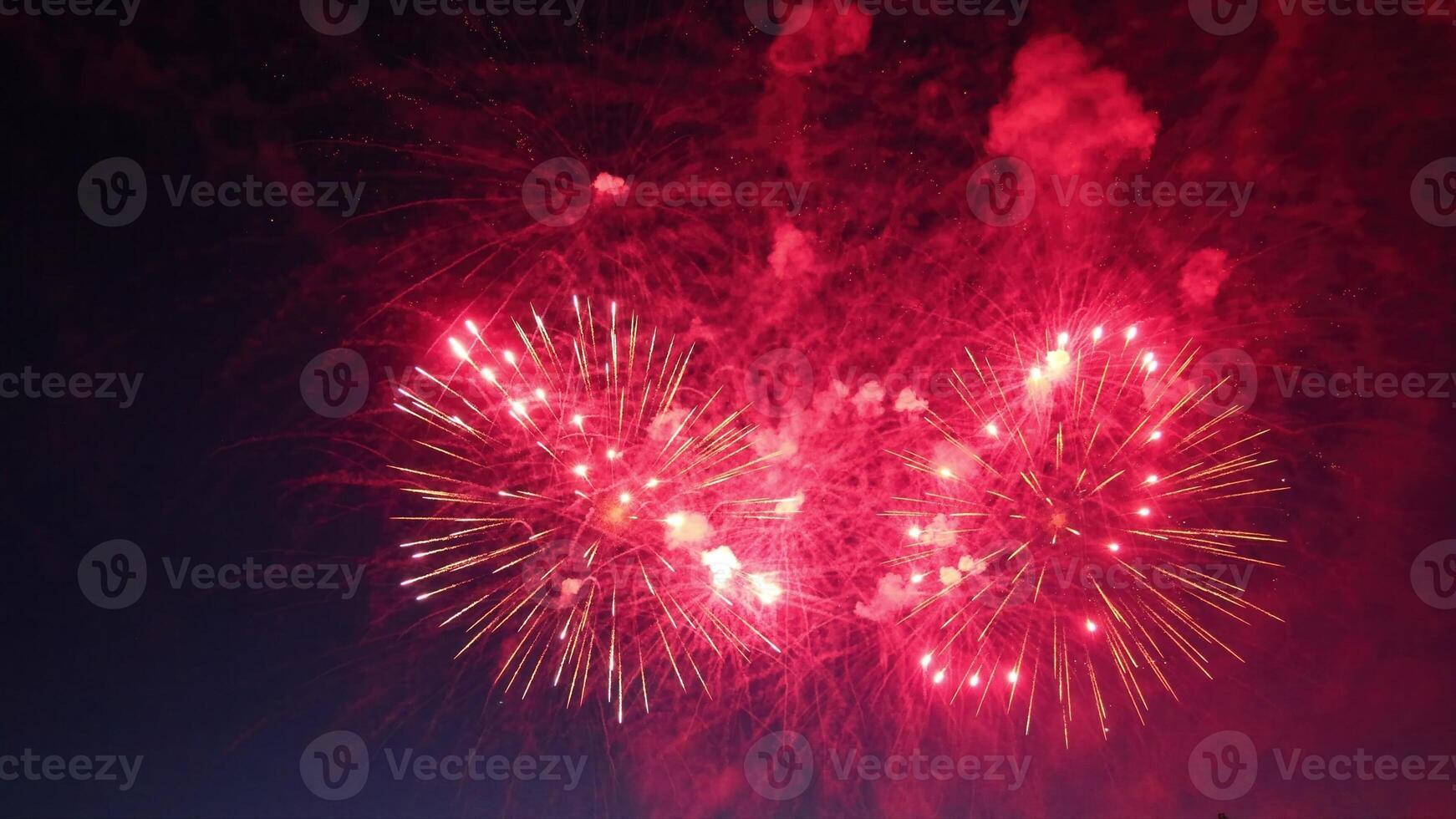 Red Fireworks Exploding in the Night Sky photo
