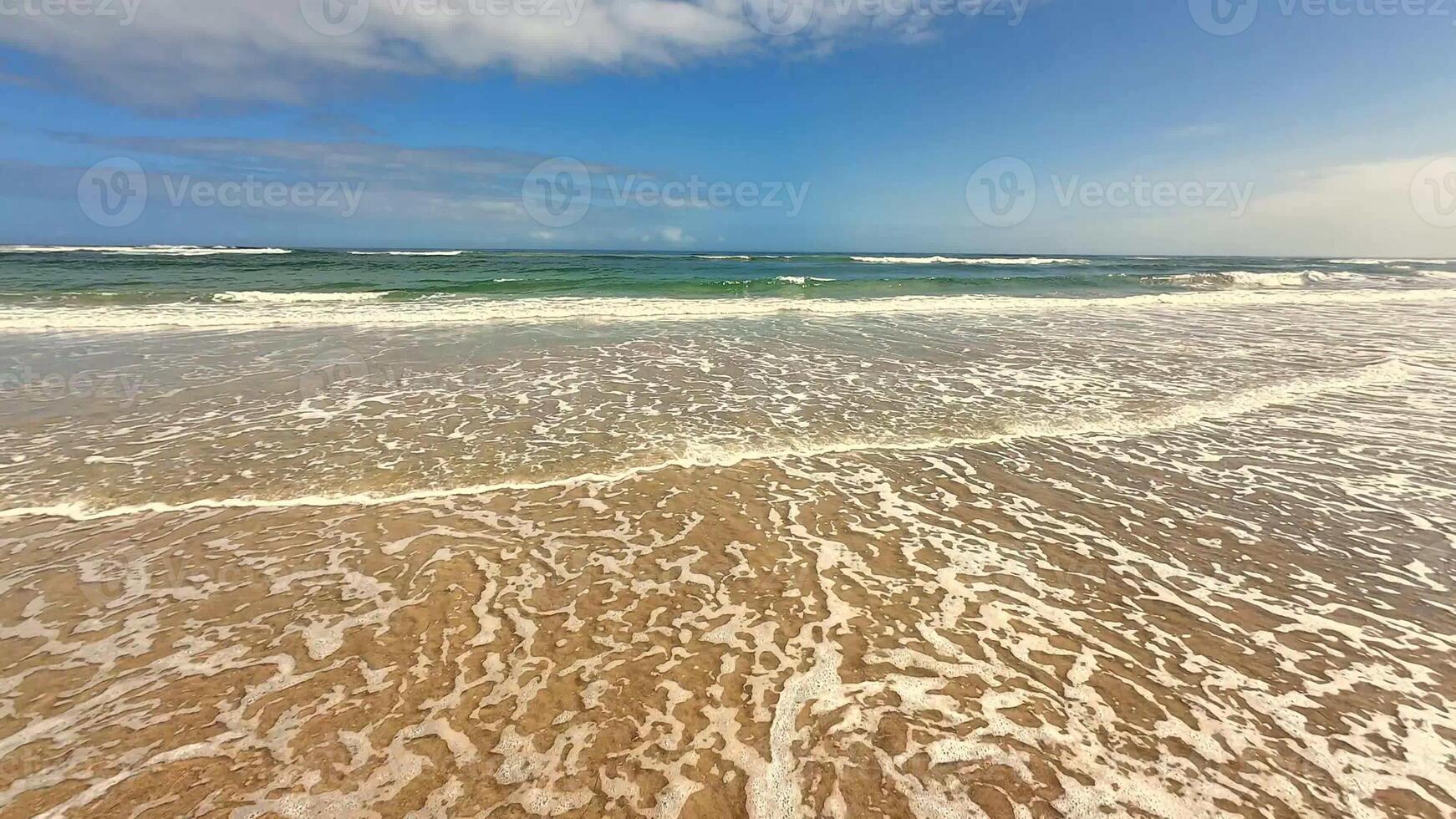 A serene and tranquil scene showcasing gentle waves slowly touching the calm shore and creating beauty photo