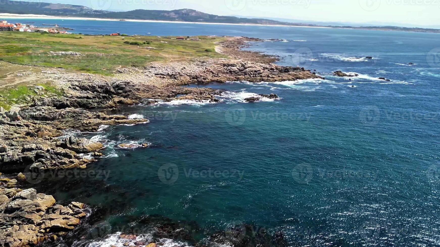 Experience stunning aerial views of rugged coastlines merging with crystalclear blue waters, inviting exploration photo