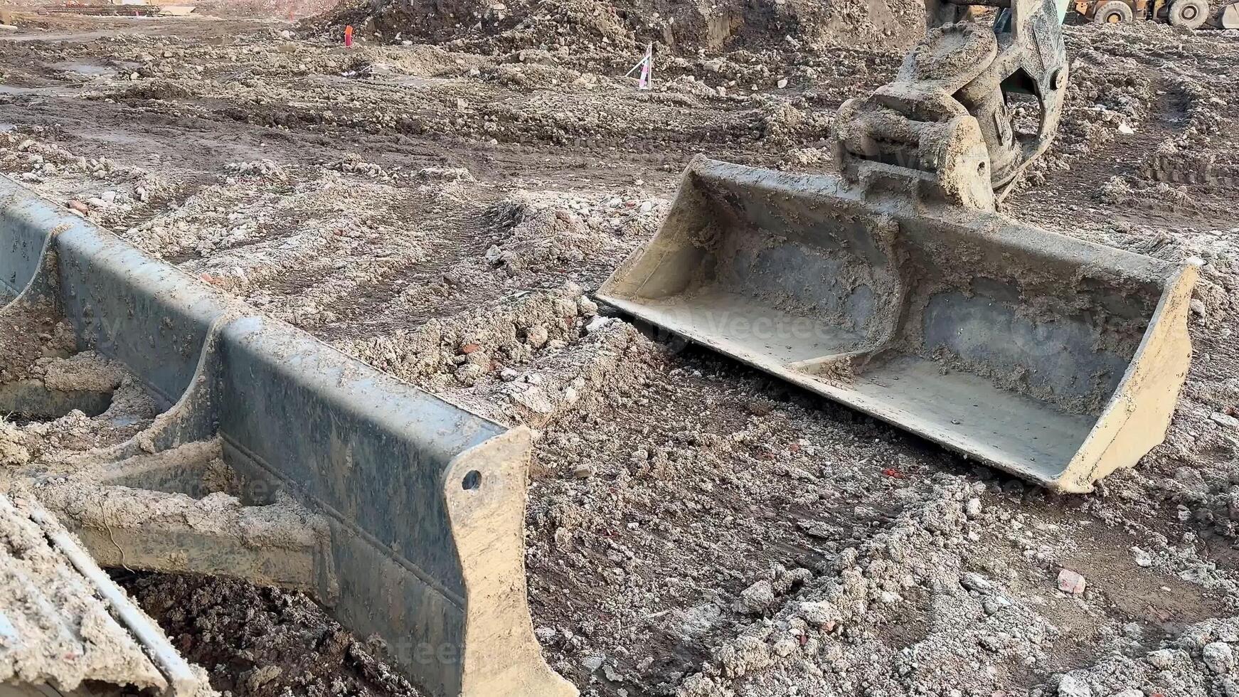 Heavy machinery equipment can be observed at an active construction site, showcasing a variety of excavation tools photo