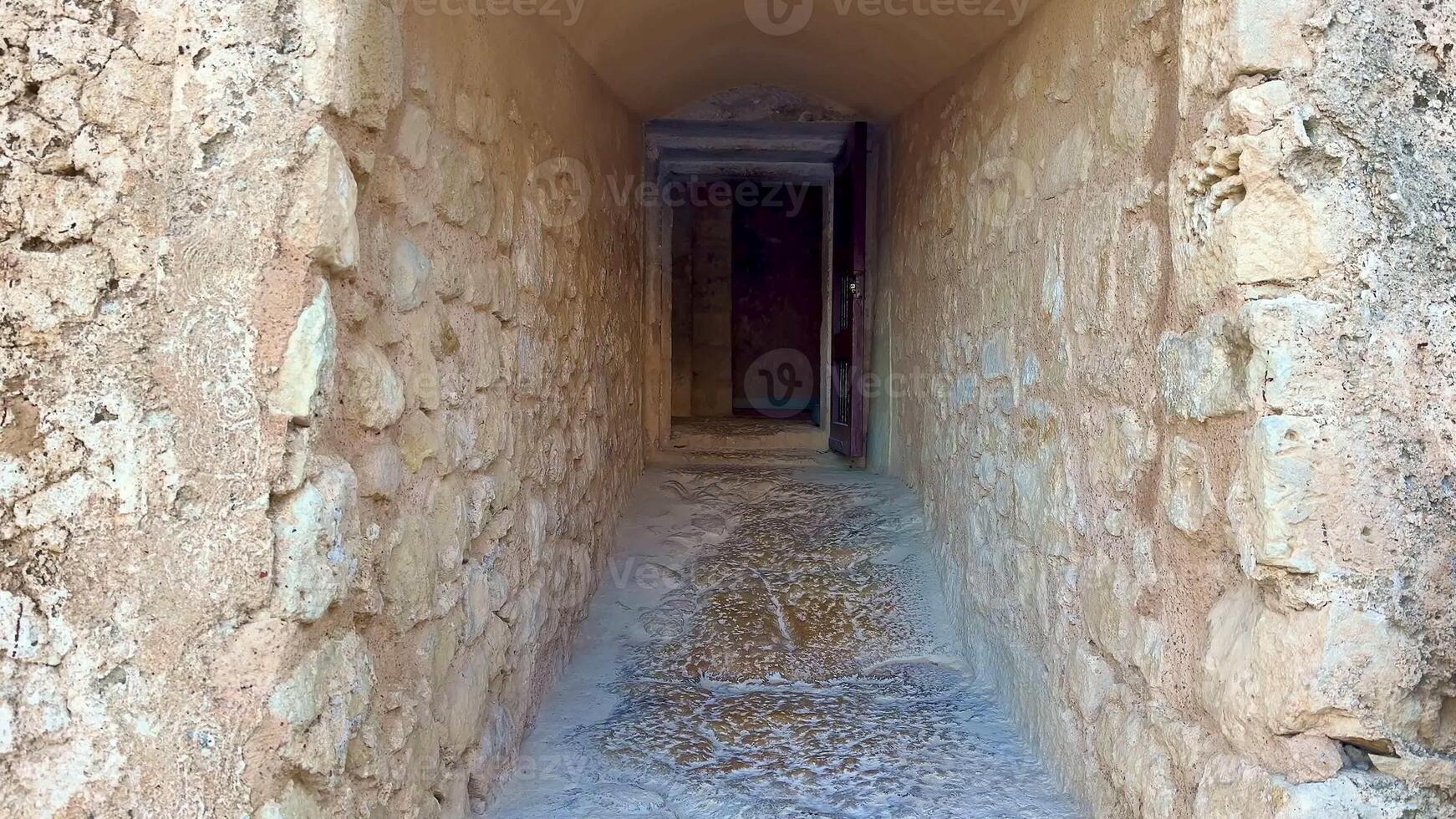 Venture into the ancient stone corridor that leads to a mysterious, unknown destination on an unforgettable adventure photo