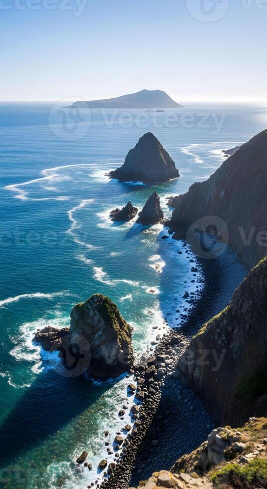 Rocky Coastal Cliffs and Pebble Beach with Turquoise Sea Under Clear Sky photo