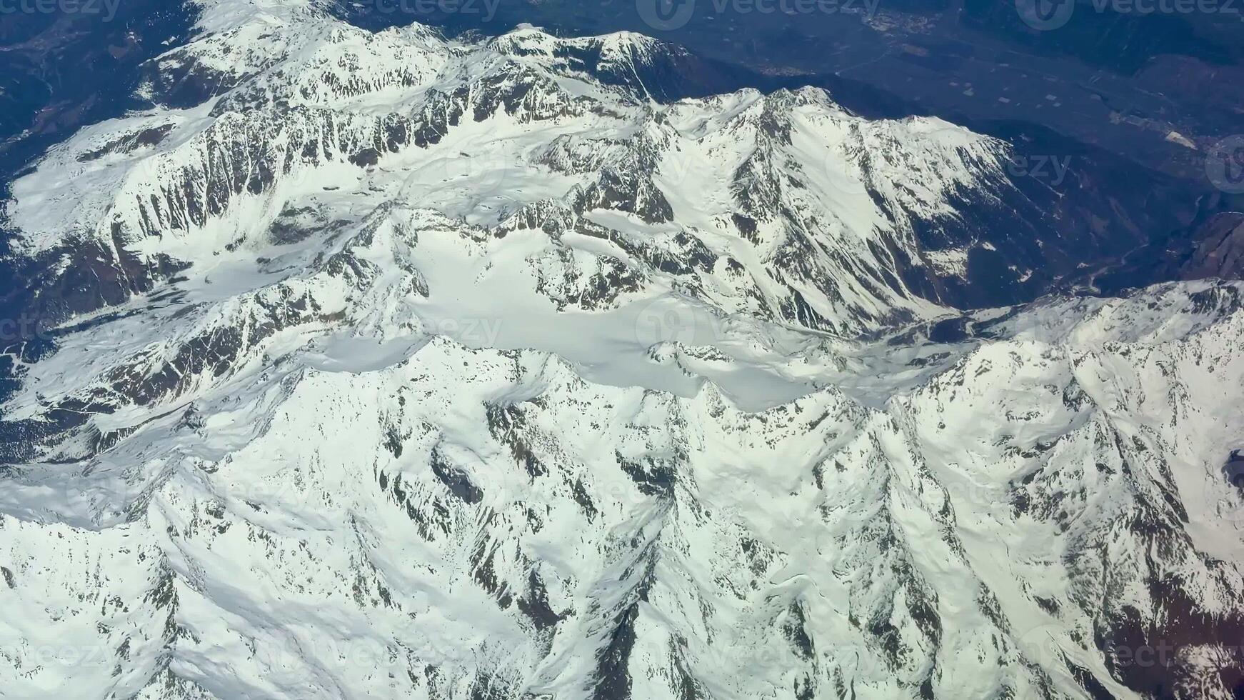 Stunning aerial imagery beautifully showcasing the majestic, snowcovered mountain ranges in all their glory photo