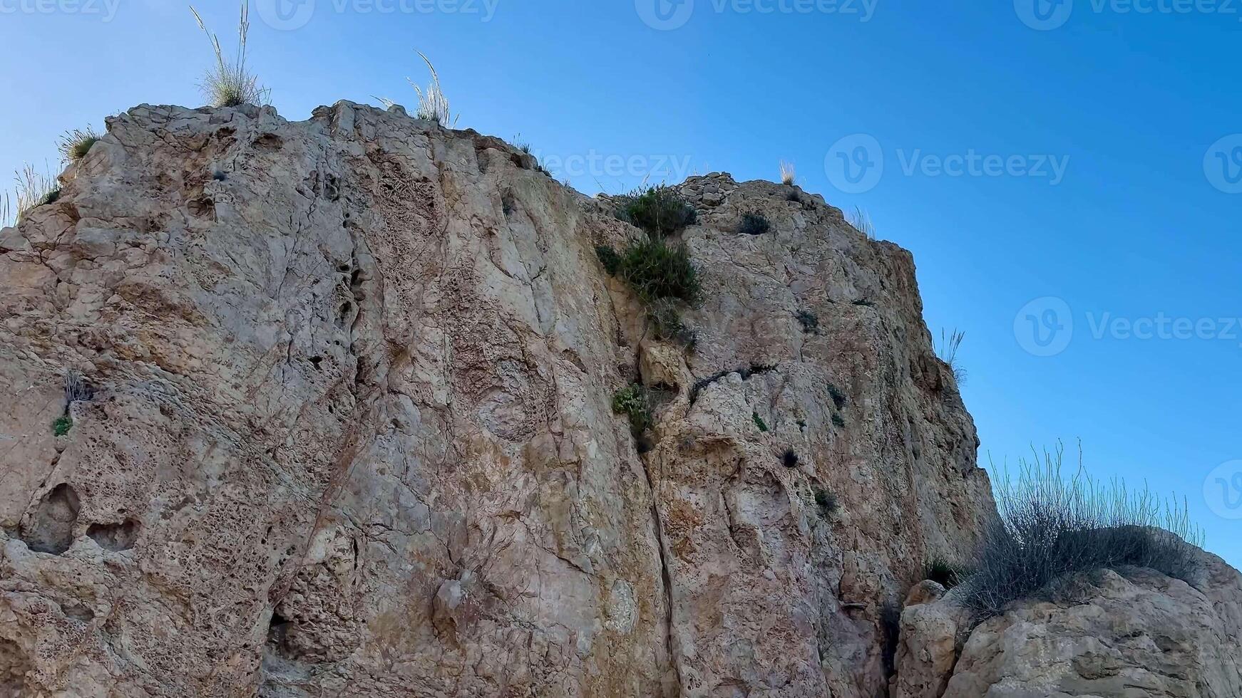 Stunning images depict breathtaking cliffs towering above and picturesque serene sea views along a beautiful coastline photo