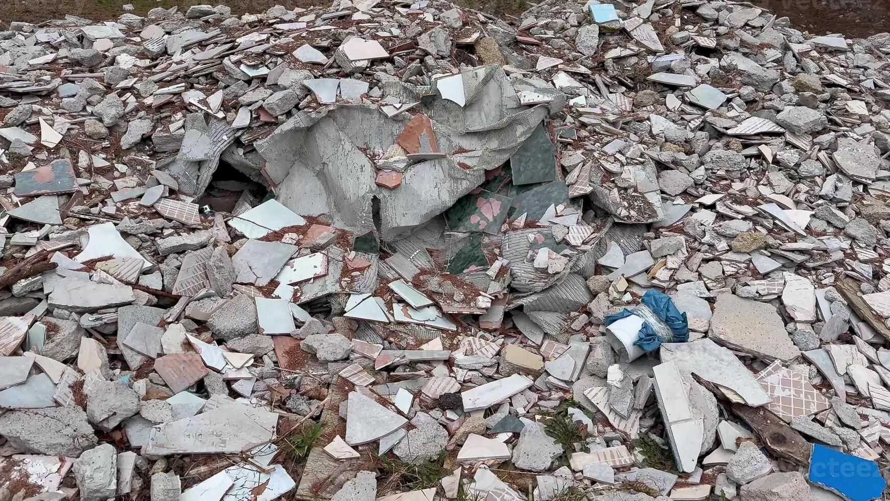 An extensive, substantial pile of construction debris vividly showcasing shattered materials, waste, and refuse photo