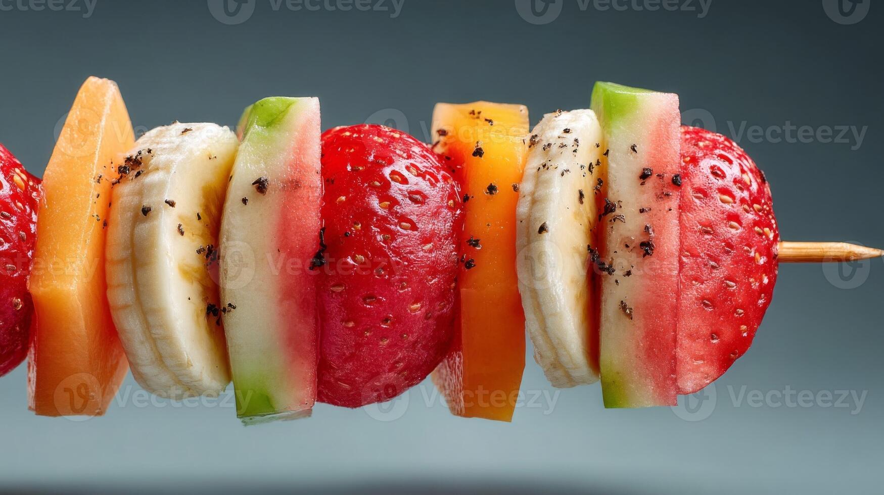 Colorful Fruit Skewer with Watermelon Strawberry Banana and Peach photo