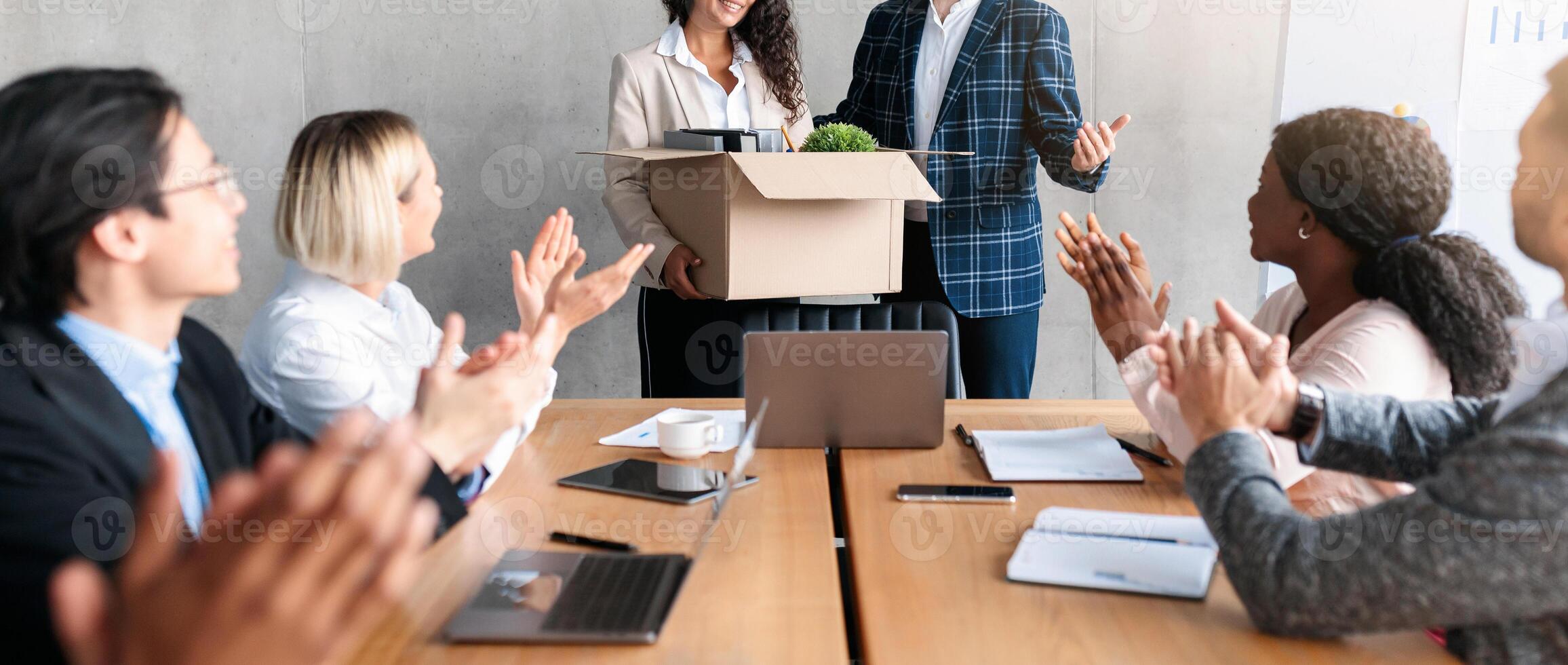 HR Manager Introducing New Female Colleague To Diverse Business People During Corporate Meeting In Modern Office. Employment, New Job And Career Growth Concept. Selective Focus photo
