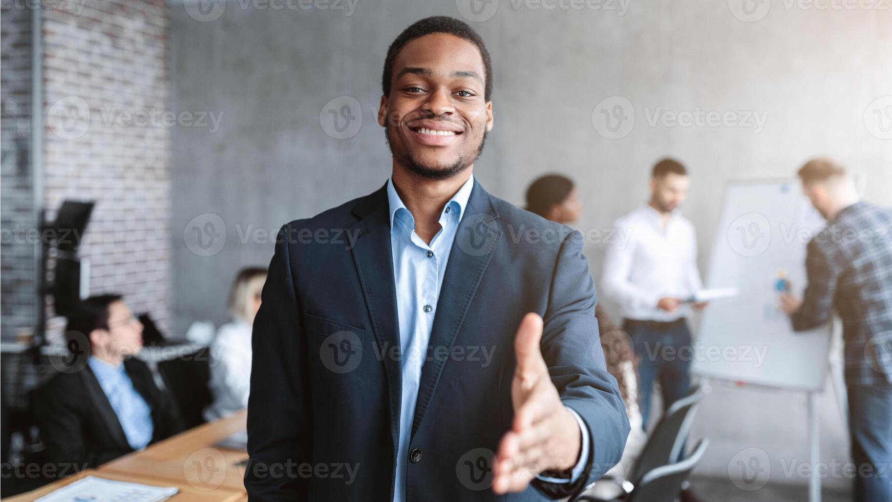 Black Businessman HR Stretching Hand For Handshake Greeting During Corporate Meeting In Modern Office, Posing Smiling To Camera. Nice To Meet You. Employment And Recruitment, Career Offer Concept photo