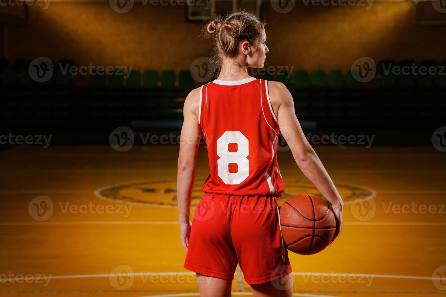 Female Basketball Player on Indoor Court photo