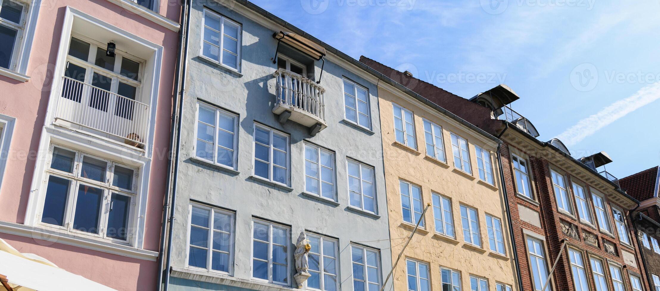 Beautiful Nyhavn area in the historical part of the city of Copenhagen with traditional houses and boats photo
