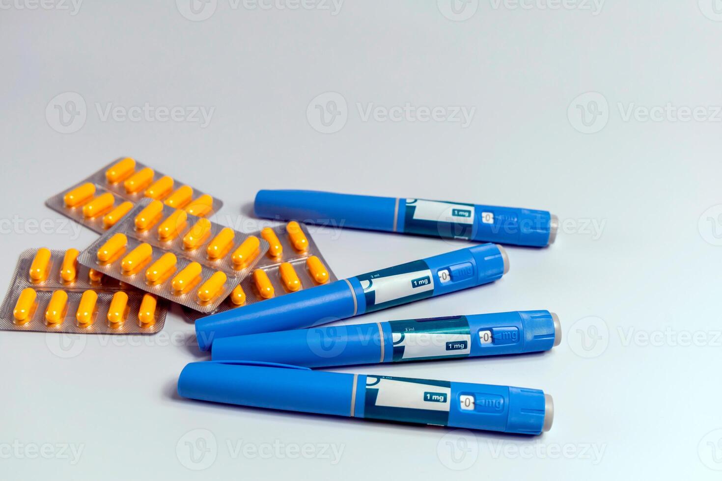 Ozempic Insulin injection pen for diabetics and weight loss and a bunch of pills photo