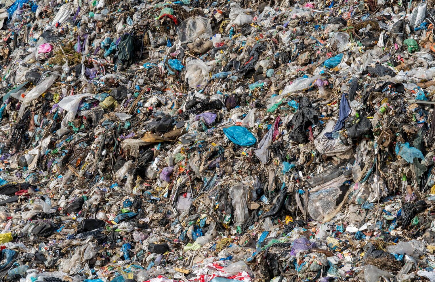 A large pile of garbage is shown in the middle of the ocean photo
