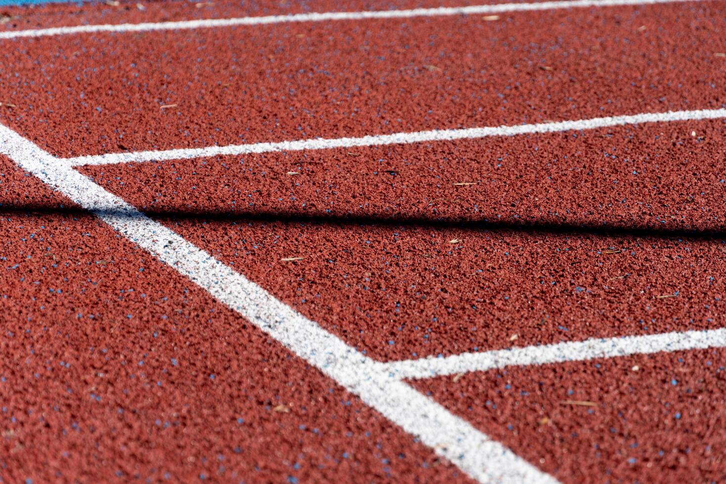 A running track with white lines on it photo