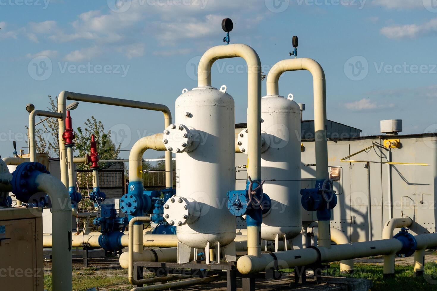 Industrial Gas Processing Plant Featuring Storage Tanks and Pipeline Network Under a Sky photo